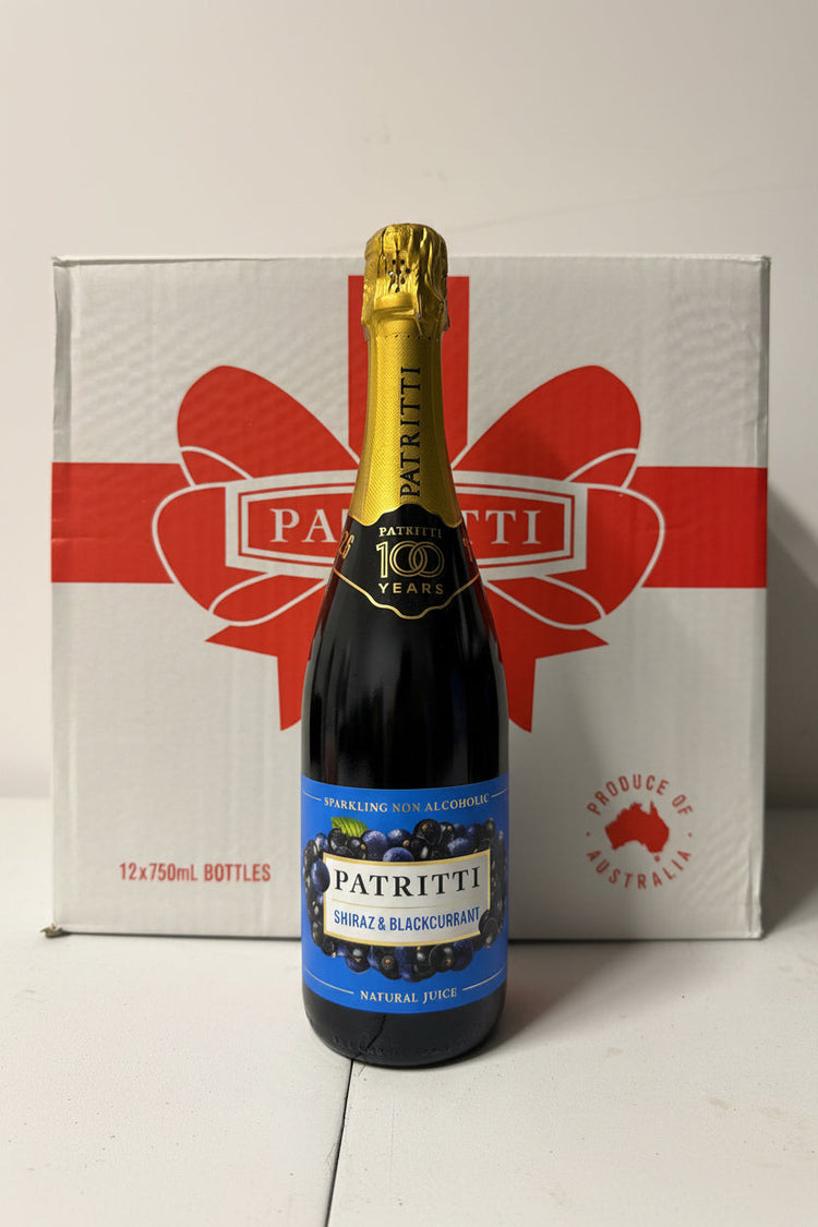 Bottle of Patritti sparkling wine on a branded box