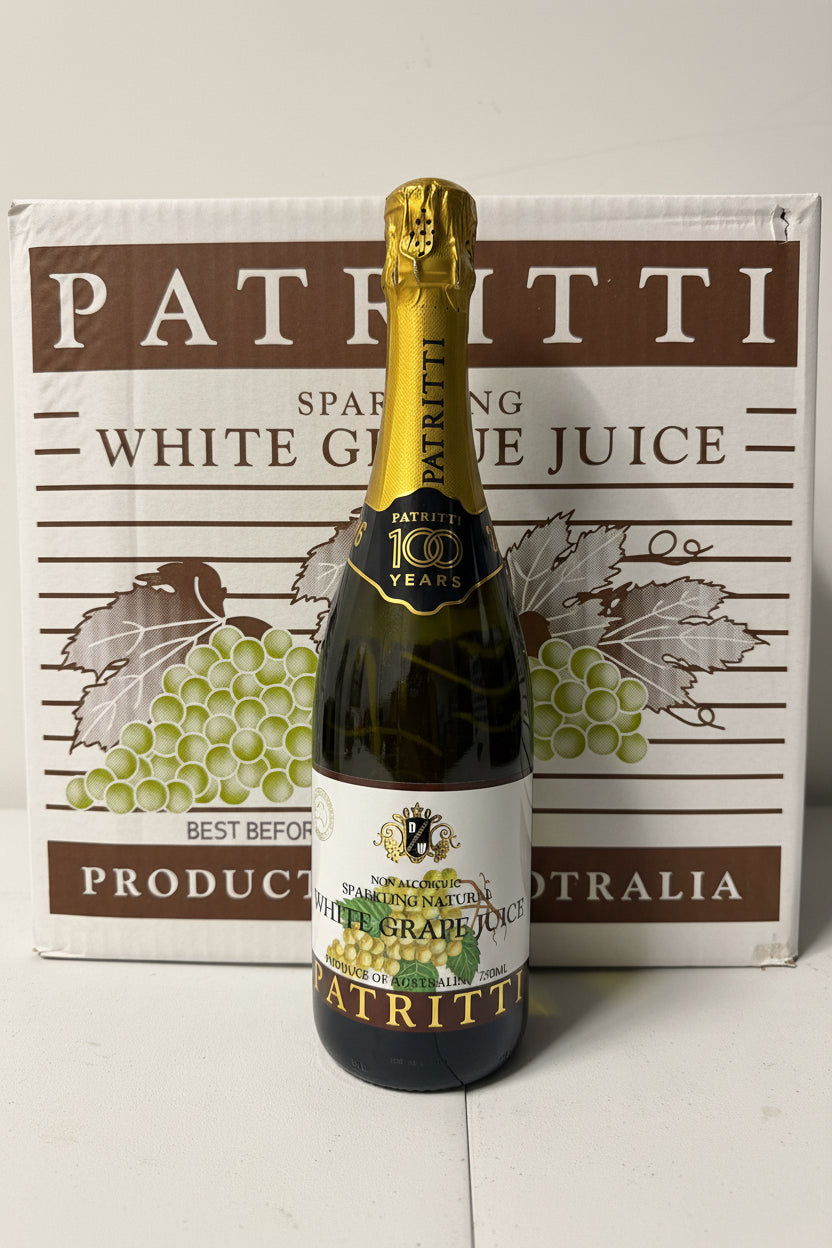 Patritti sparkling white grape juice bottle with packaging in the background